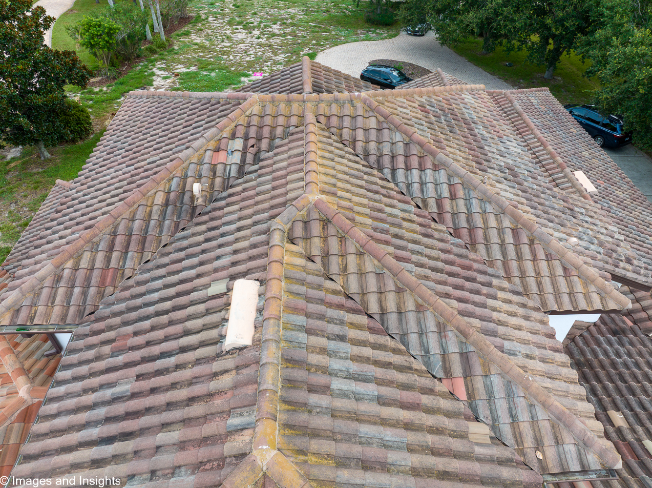 Drone roof inspection Brevard County — close-up of damaged roof valley tile