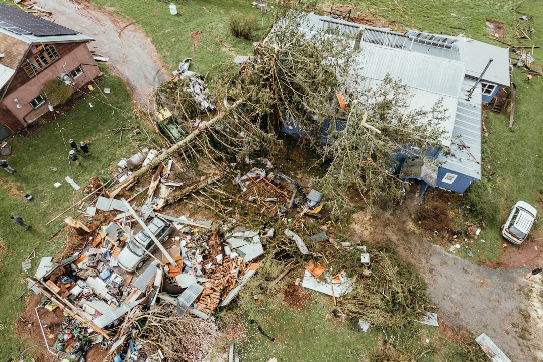 Storm damage drone documentation Brevard County — close aerial view of tornado roof damage (Photo: Clay Banks / Unsplash)